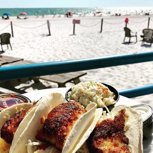 Plate of Fish tacos by the beach
